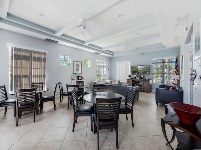 dining room with light tile patterned floors, ceiling fan, and a healthy amount of sunlight