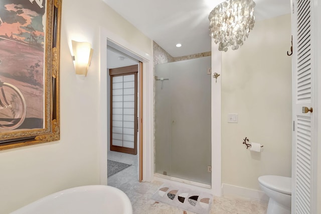 bathroom with tile patterned floors, toilet, plus walk in shower, and an inviting chandelier