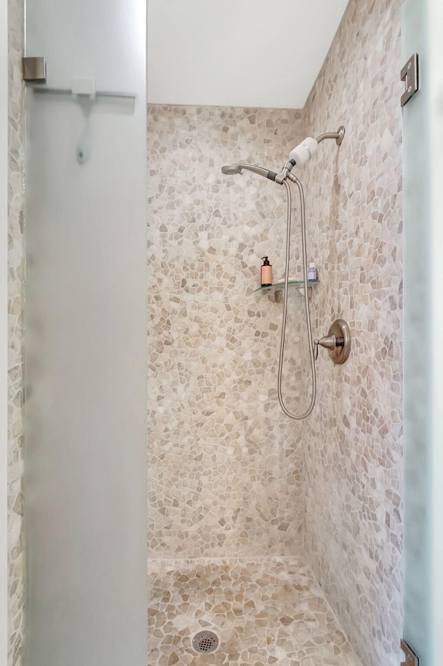 bathroom with tiled shower