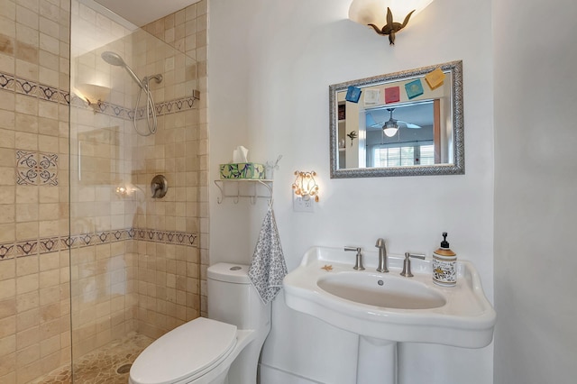 bathroom with tiled shower and toilet