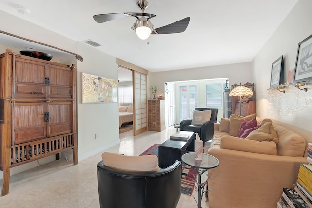 living room with ceiling fan