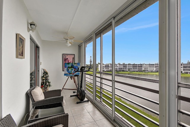 sunroom featuring ceiling fan