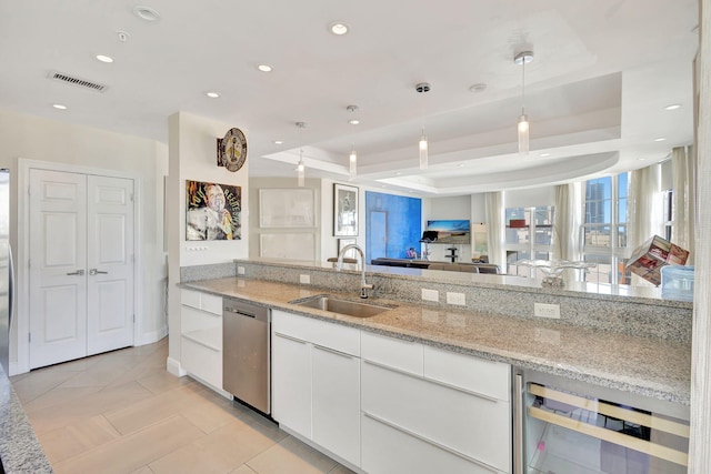 kitchen featuring wine cooler, sink, light stone counters, dishwasher, and white cabinets