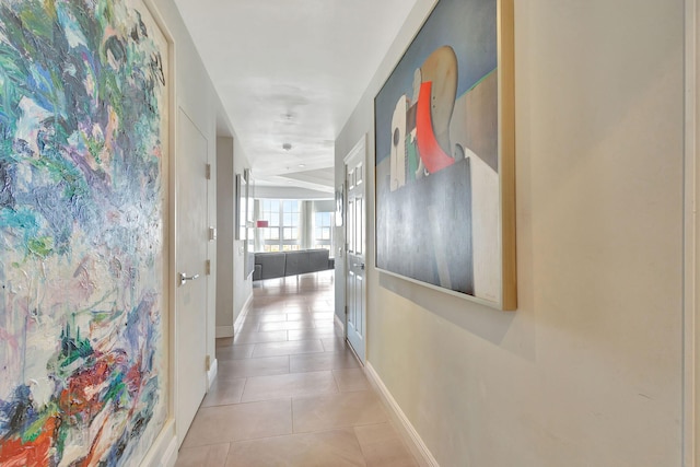 hall featuring light tile patterned flooring