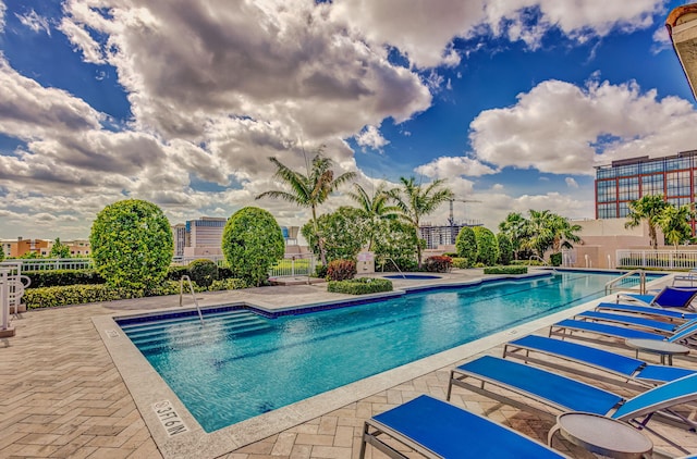 view of swimming pool featuring a patio area