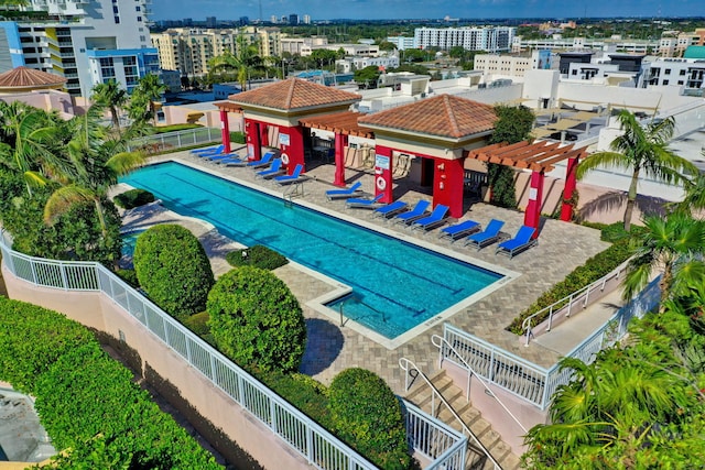 view of pool with a pergola and a patio