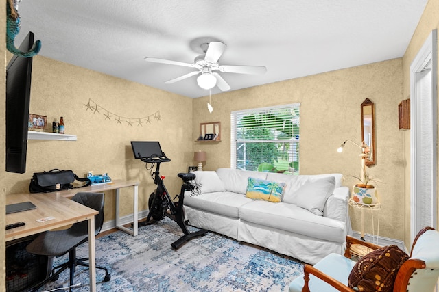 office featuring ceiling fan and a textured ceiling