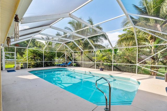 view of pool with a lanai and a patio