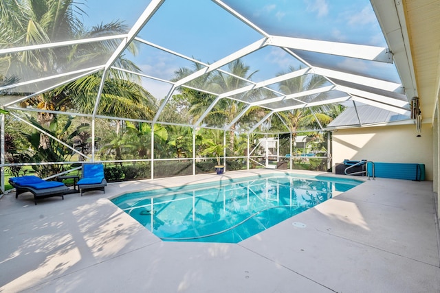 view of pool with a lanai and a patio area