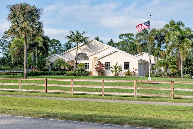 ranch-style house featuring a front yard