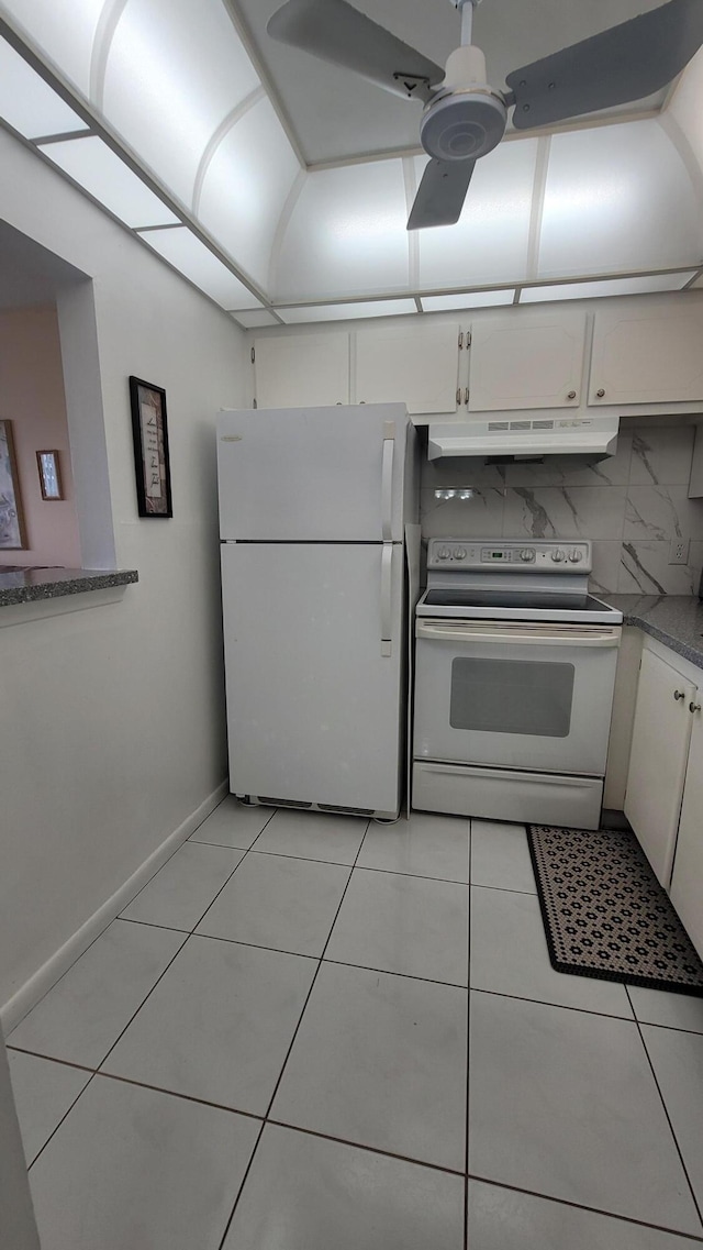 kitchen featuring white appliances, backsplash, ceiling fan, light tile patterned flooring, and white cabinetry