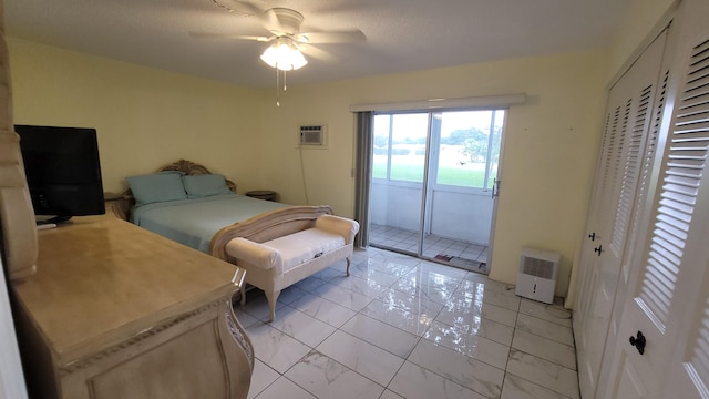 bedroom featuring ceiling fan, access to exterior, and a wall mounted AC