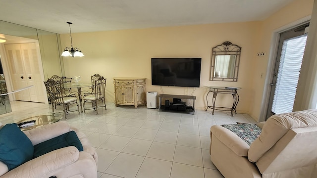 tiled living room with an inviting chandelier