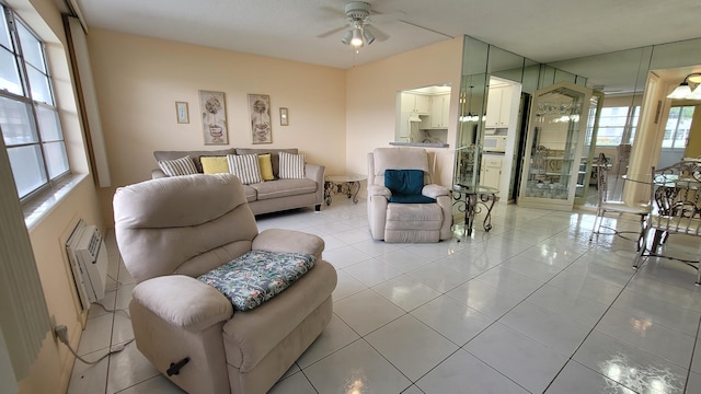 tiled living room featuring ceiling fan