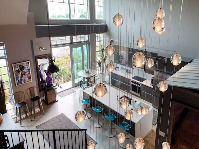 kitchen with a wealth of natural light and a towering ceiling