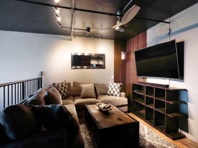 living room featuring wood-type flooring and track lighting