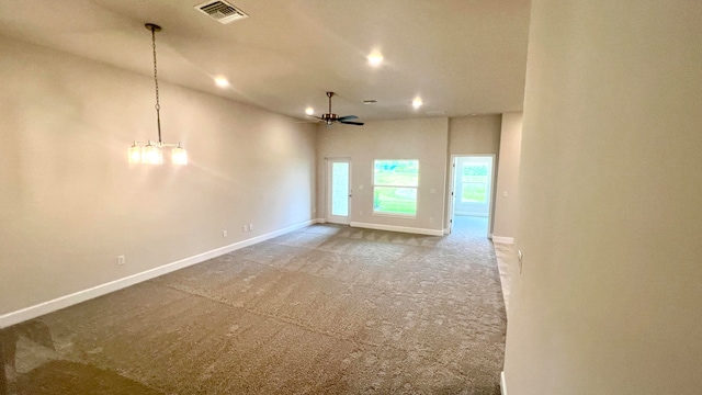 unfurnished room featuring ceiling fan and carpet floors