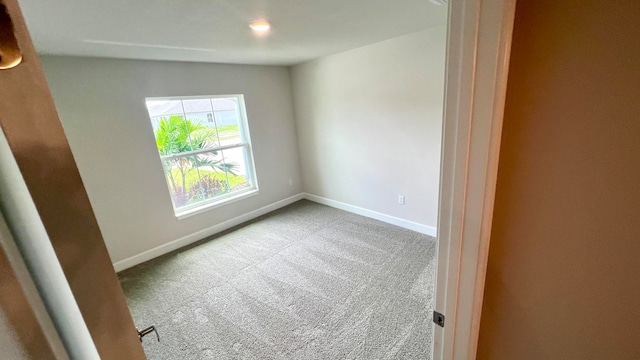 empty room with light colored carpet