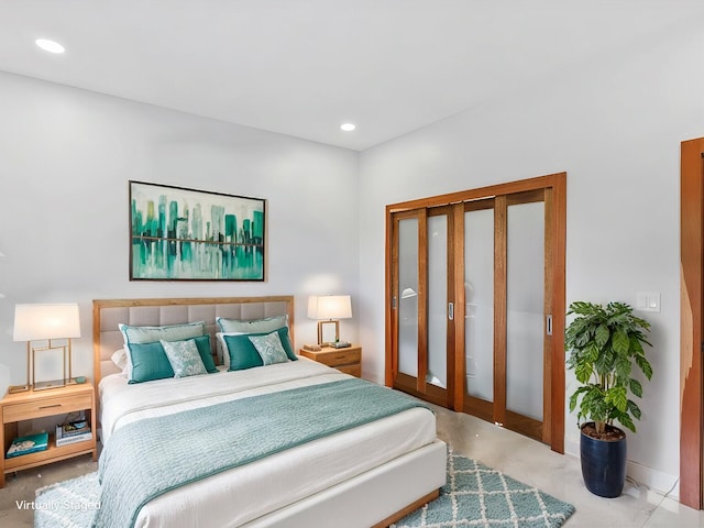 bedroom featuring recessed lighting and concrete floors