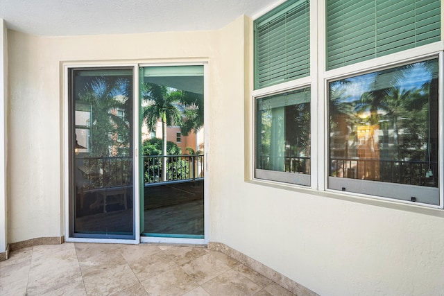 doorway to property featuring a patio