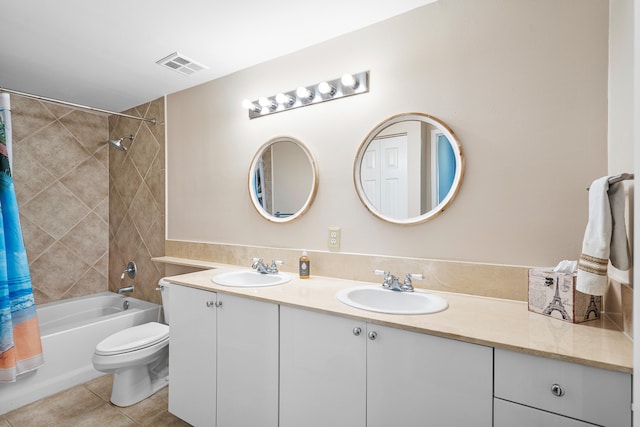 full bathroom with tile patterned flooring, vanity, toilet, and shower / tub combo