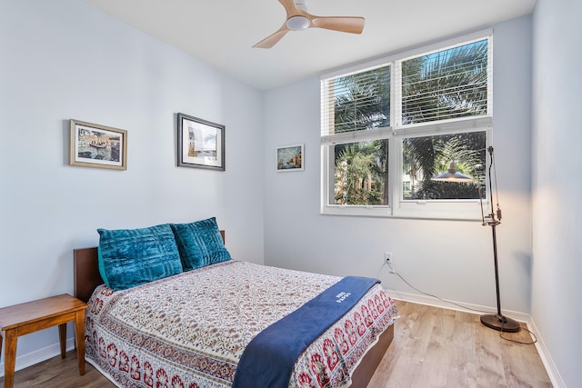 bedroom featuring ceiling fan and light hardwood / wood-style flooring