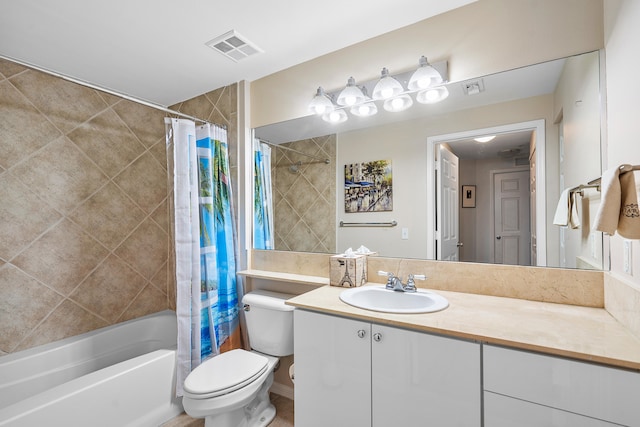 full bathroom with vanity, toilet, and shower / bath combo