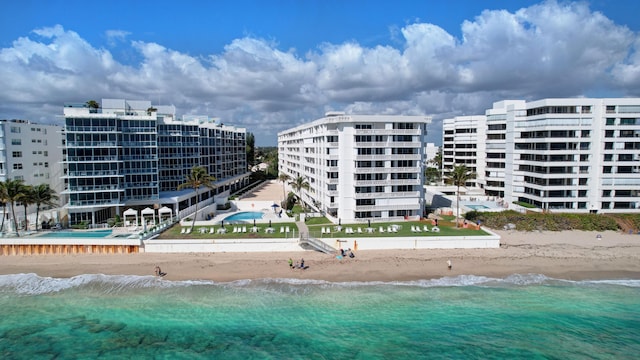 exterior space featuring a view of the beach and a water view