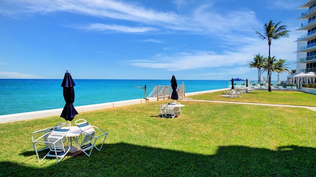 property view of water featuring a beach view