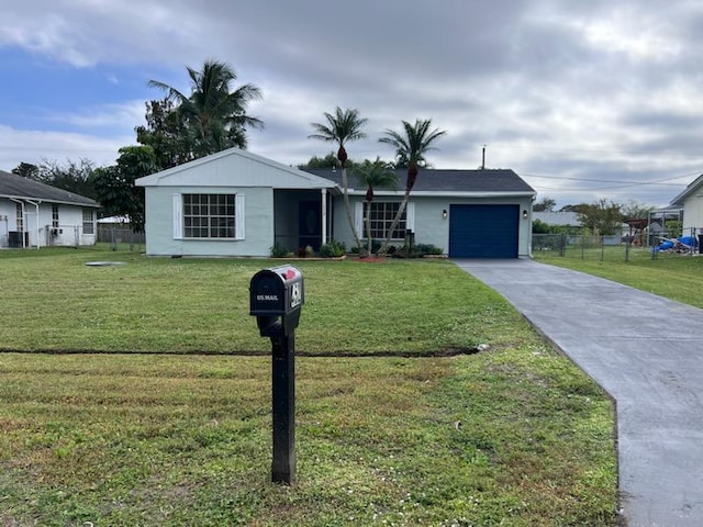 single story home with a front yard and a garage