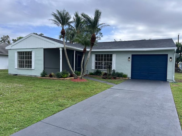 single story home with a garage and a front lawn