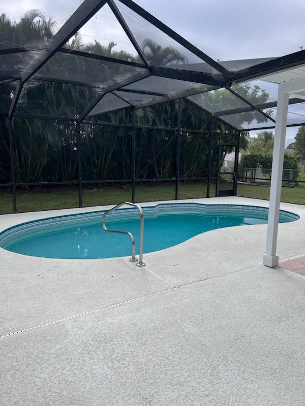 view of pool featuring a patio area and a lanai