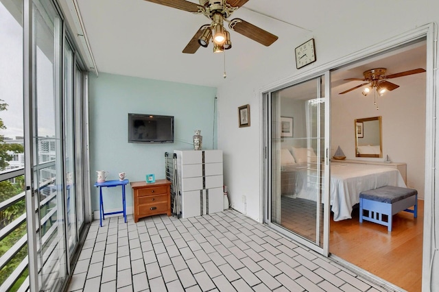 sunroom / solarium with ceiling fan