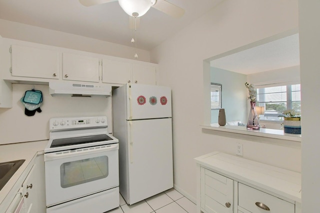 kitchen featuring light tile patterned floors, white appliances, white cabinetry, and ceiling fan