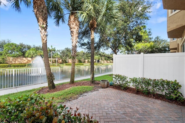 view of patio with a water view