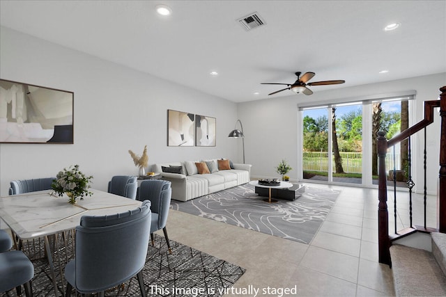 tiled living room featuring ceiling fan