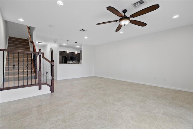 interior space with light tile patterned floors and ceiling fan