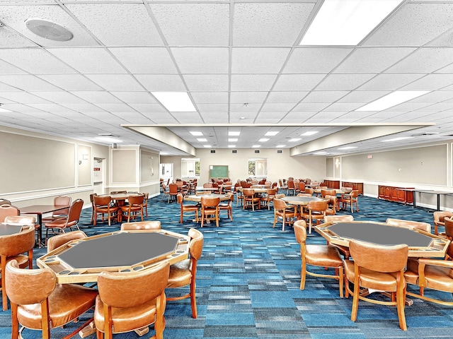 dining room with carpet flooring and a paneled ceiling