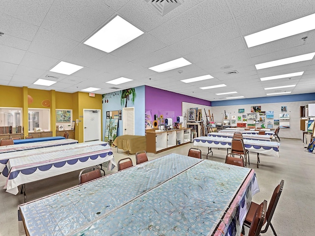 dining area featuring a drop ceiling and visible vents