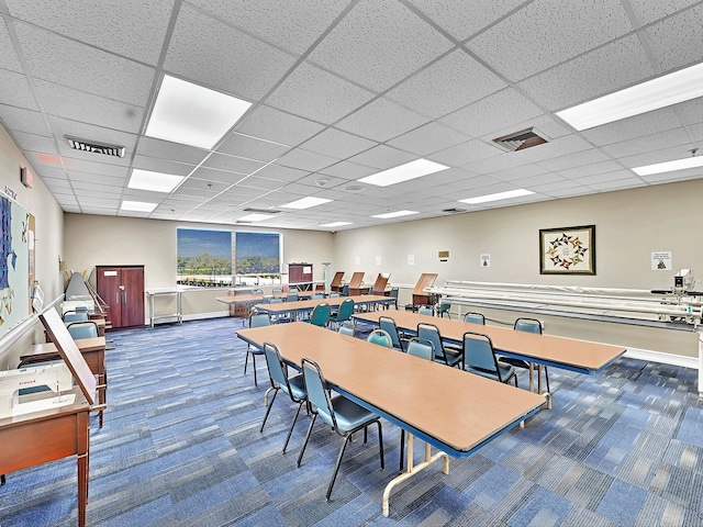 interior space with a drop ceiling and visible vents