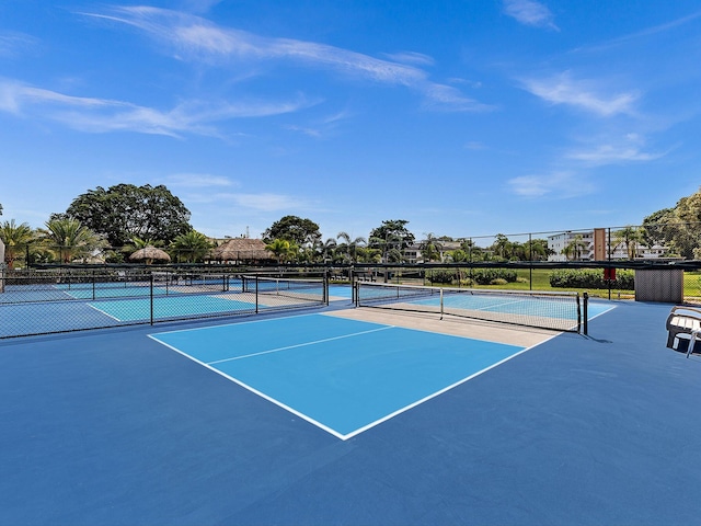 view of sport court with fence