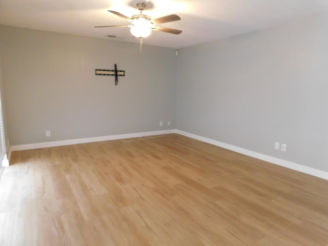 unfurnished room featuring ceiling fan and light hardwood / wood-style floors