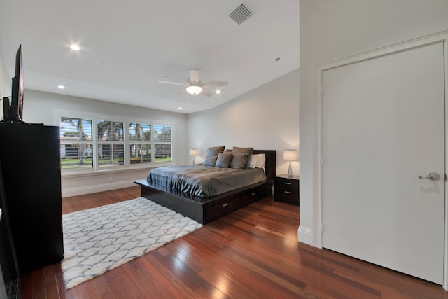 bedroom featuring ceiling fan and dark wood-type flooring