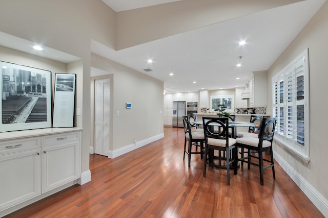 dining area featuring dark wood-type flooring