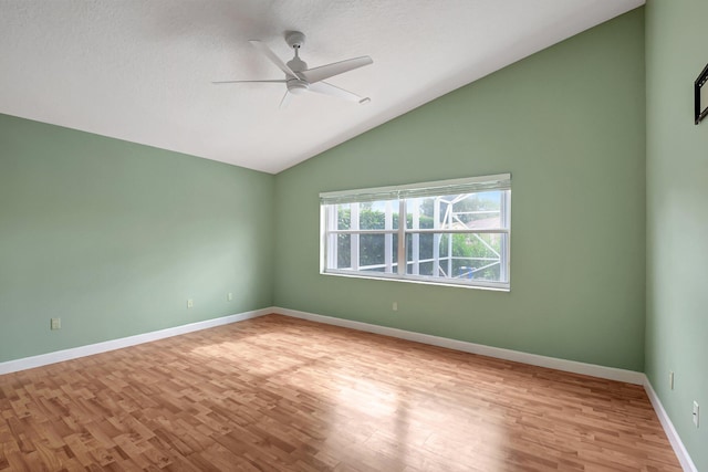 spare room with ceiling fan, light hardwood / wood-style floors, and lofted ceiling