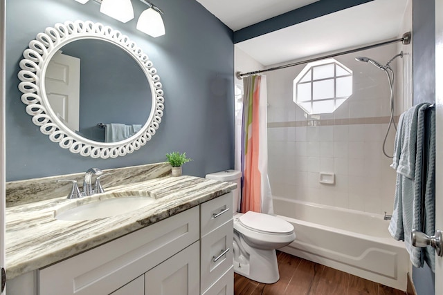 full bathroom with vanity, wood-type flooring, shower / tub combo, and toilet