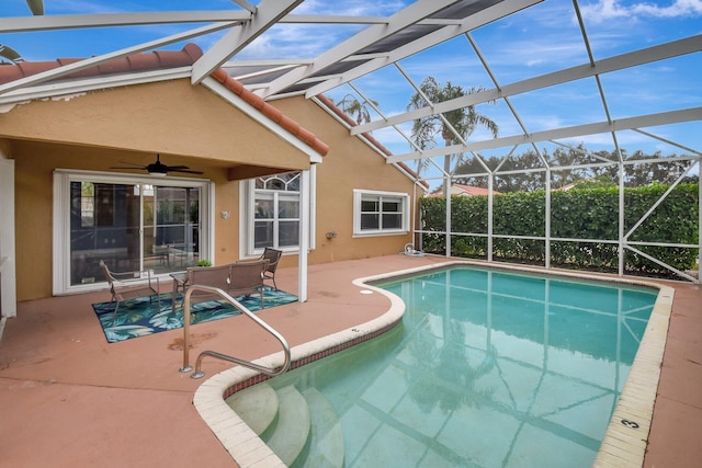 view of swimming pool with a lanai, a patio area, and ceiling fan