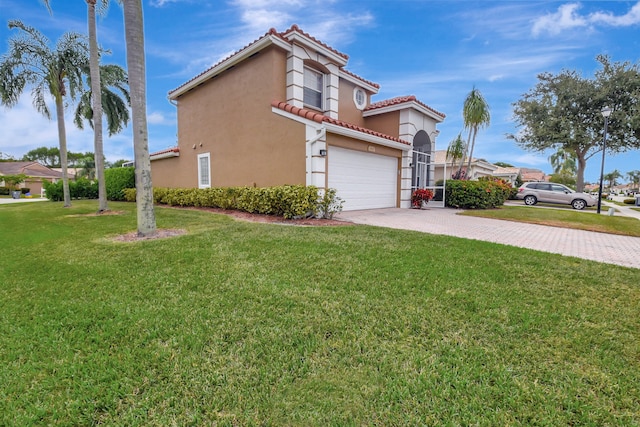 view of side of home featuring a lawn and a garage