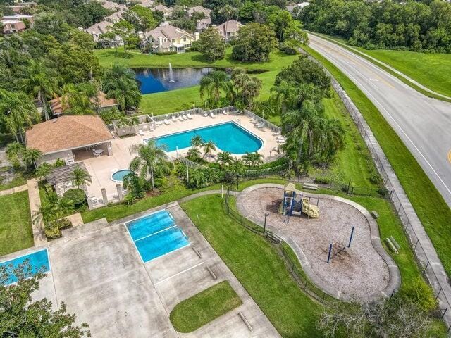 3537 SW Sunset Trace Cir, Palm City, FL 34990 - bird's eye view of a pool area and a nearby body of water
