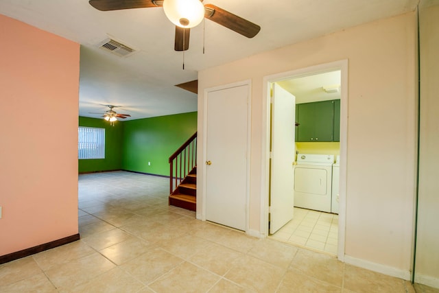 interior space with washer and dryer and light tile patterned floors